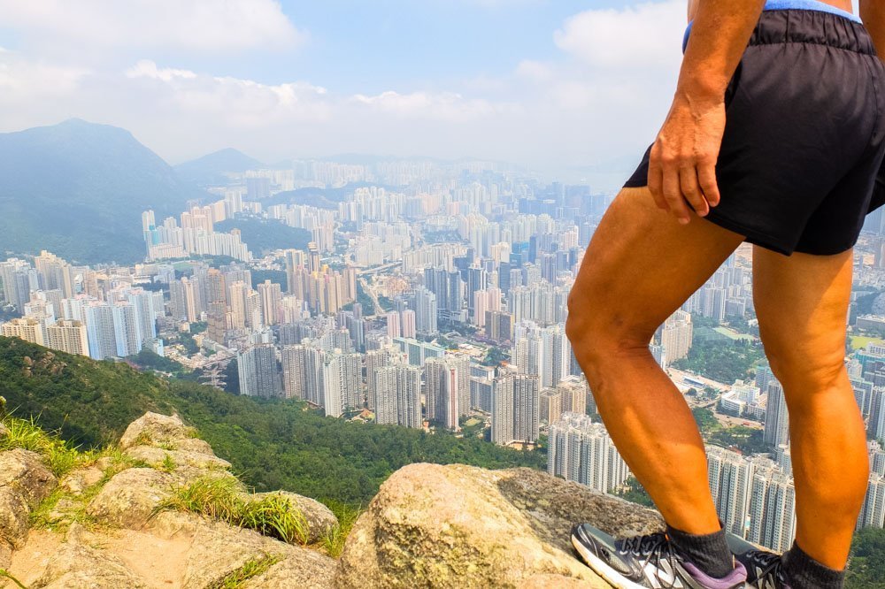Man standing on the Lion's Rock peak