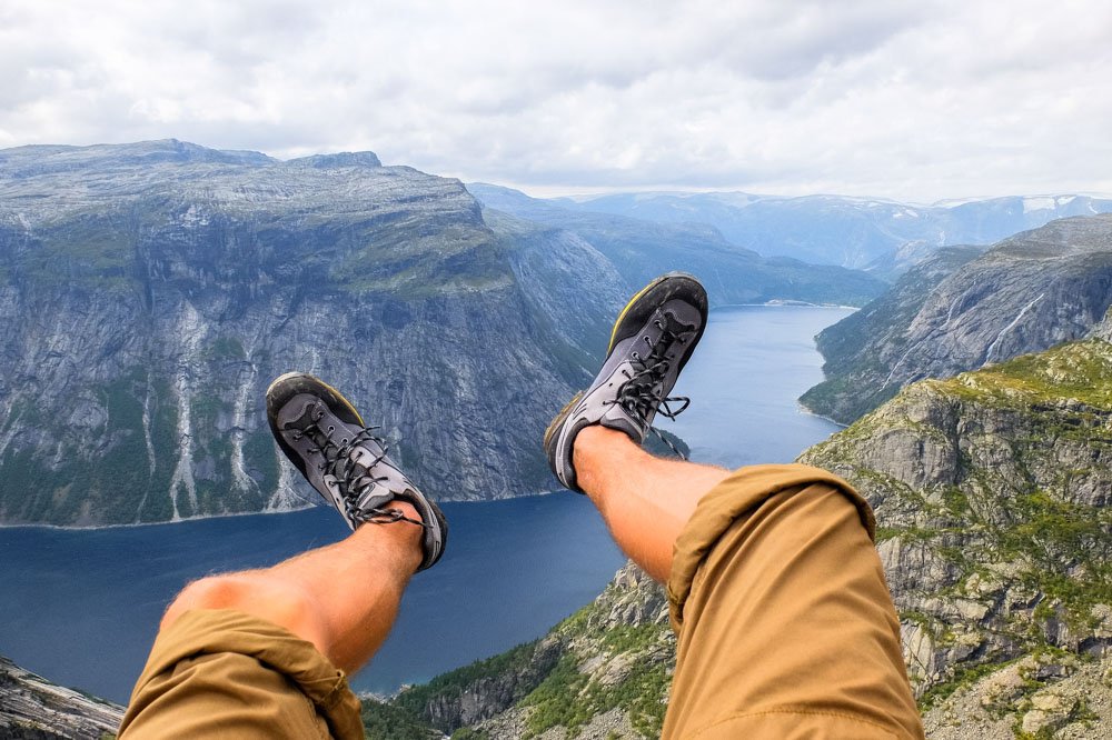 Kaspars legs in the air over fjords in Norway