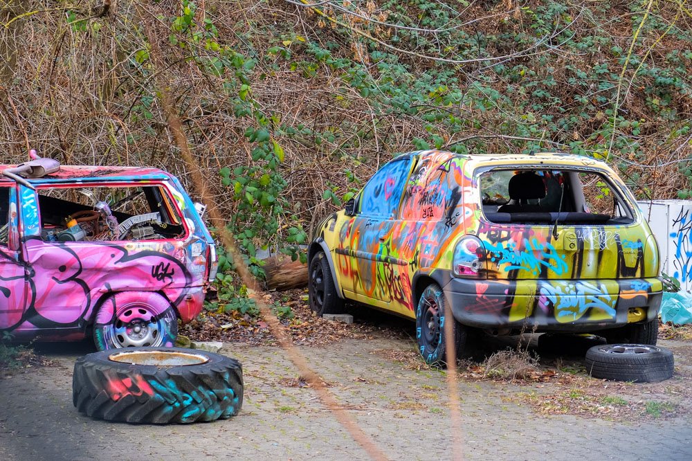 Colorfully painted cars at Teufelsberg