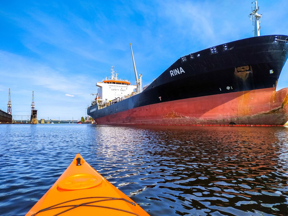 Kayaking next to a big ship