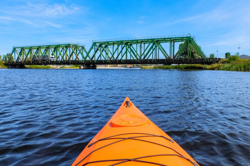 Kayaking next to railway bridge