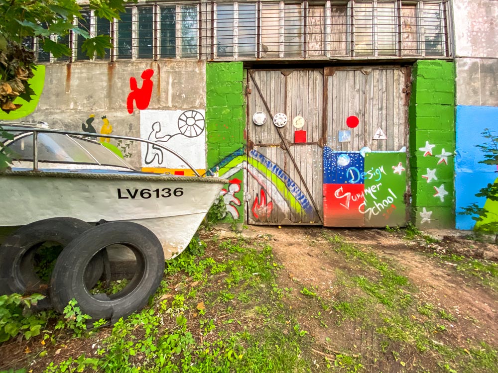A boat next to an old building