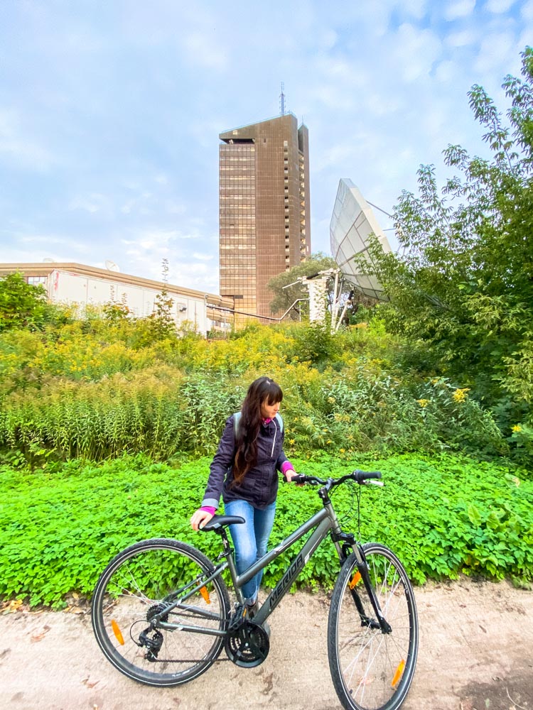 Cyclist and a tall building in the distance