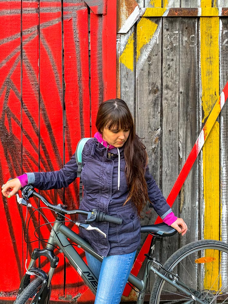 Posing next to colorful wall