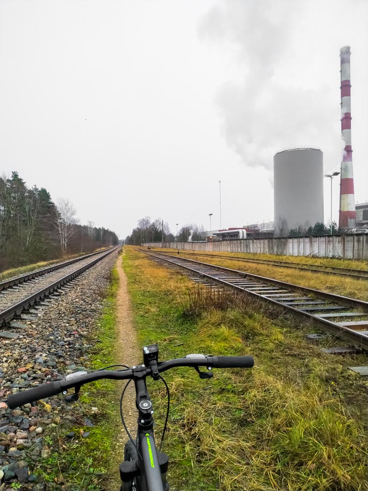 Bicycle standing next to rails