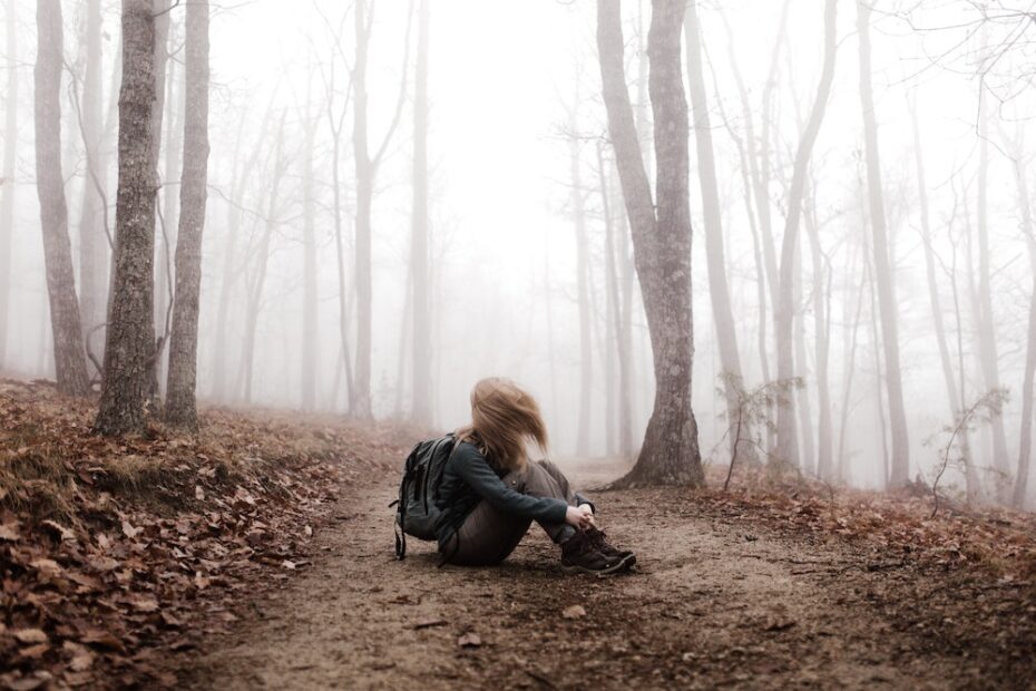 Woman hiking in the mist