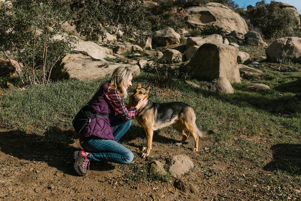 Woman hiking with her dog
